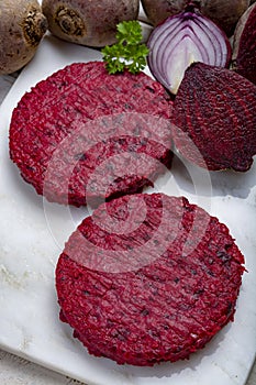 Healthy vegetarian food, raw round burgers made from red beetroot