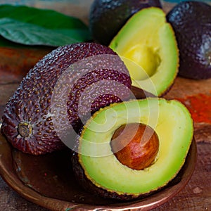 Healthy vegetarian food â€“ green ripe avocado, new harvest, wit