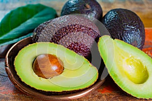 Healthy vegetarian food â€“ green ripe avocado, new harvest, wit