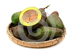 Healthy vegetarian food â€“ green ripe avocado, new harvest, wit. Dish, ornamental.