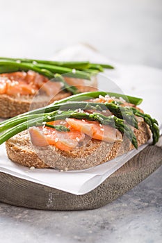 Healthy vegetarian meal. Toast,  asparagus, salmon fish. Stone background. Clean eating Diet. Organic food