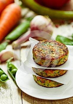 Healthy vegetarian patties made from potatoes, carrots, onions, green peas, herbs and spices.