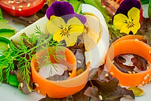 Healthy vegetarian summer salad with edible flowers