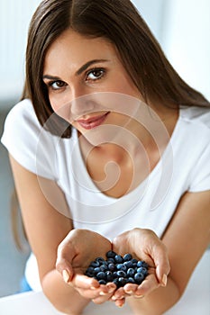 Healthy Vitamin Food. Beautiful Smiling Woman With Blueberries