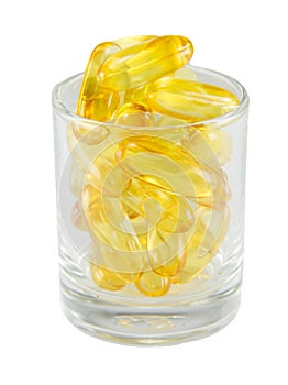 Healthy vitamin glass : yellow oil pills in translucent glass