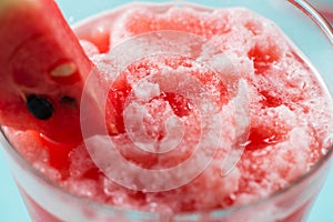 Healthy watermelon smoothie on blue background