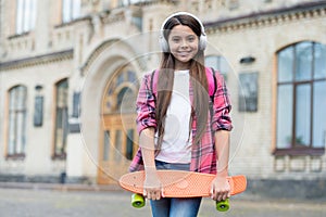 Healthy way of getting to your destination. Little girl hold penny board outdoors. Transportation concept. Wheeled sport
