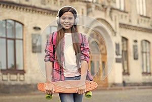 Healthy way of getting to your destination. Little girl hold penny board outdoors. Transportation concept. Wheeled sport