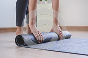 Healthy and wellness lifestyles concept. Woman prepare yoga mat to meditation