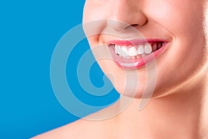 Healthy white smile close up. Beauty woman with perfect smile, lips and teeth. Beautiful Model Girl with perfect skin. Teeth