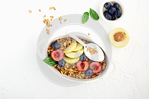 Healthy whole grain breakfast. Baked granola from oatmeal flakes in caramel with fresh berries and fruits of cherries