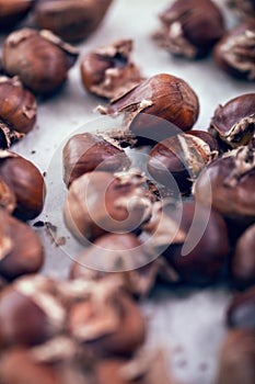 Healthy winter snack chestnuts on wooden background