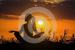 Healthy woman doing yoga outdoor, body care meditation concept