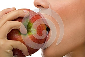 Healthy woman eating apple