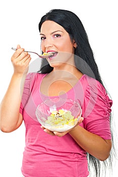 Healthy woman eating cornflakes cereals