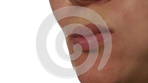 Healthy woman eating an red apple on a white background. close-up lips. healthy food and dieting concept. slow motion