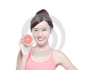 The healthy woman with grapefruit