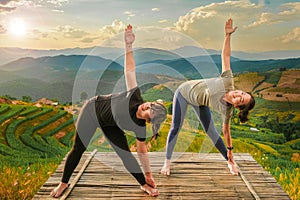 Healthy woman lifestyle balanced practicing meditate and zen energy yoga outdoors on the bridge in morning the mountain nature.