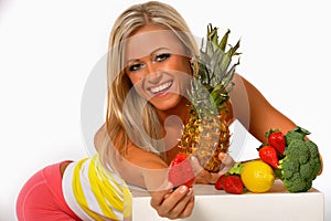 Healthy woman offering fresh strawberry
