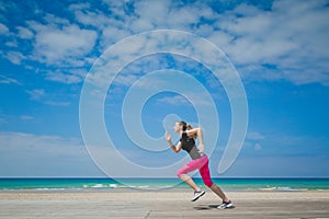 Healthy woman running on the beach, girl doing sport outdoor, happy female exercising, freedom, vacation, fitness and