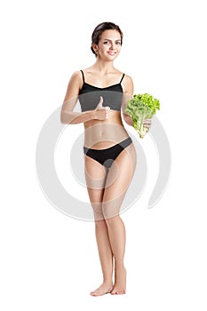 Healthy woman with salad leaves