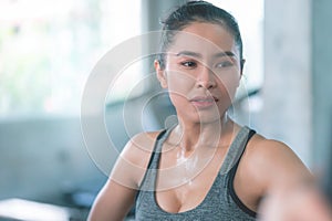 Healthy Woman is sweating while they exercising in Fitness Gym