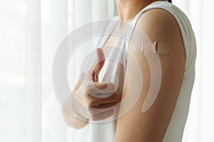 Healthy woman thumb up after getting vaccinated immunity, vaccination, vaccinated patient, vaccine roll-out program