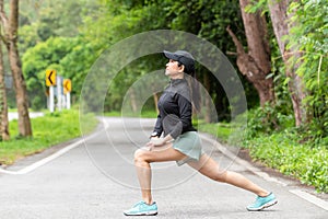 Healthy woman warming up stretching her arms. Asian runner woman workout before fitness and jogging session