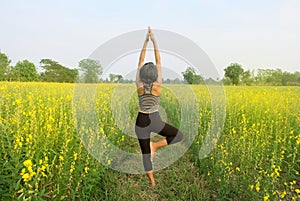 Healthy woman yoga field.