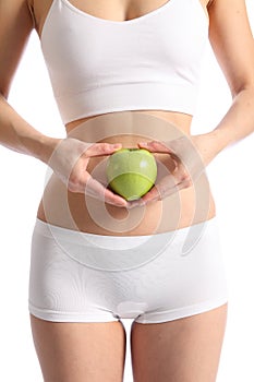 Healthy womans body white underwear holding apple