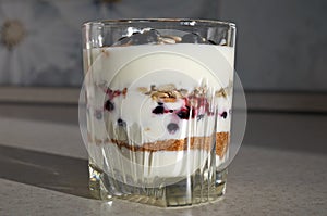 Healthy yogurt with mix of berry, sunflower seeds, bran and honey for healthy morning meal