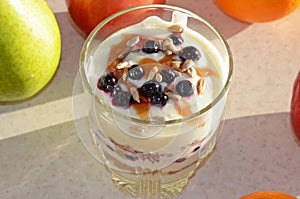 Healthy yogurt with mix of berry, sunflower seeds, bran and honey for healthy morning meal