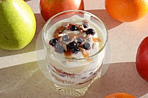 Healthy yogurt with mix of berry, sunflower seeds, bran and honey for healthy morning meal