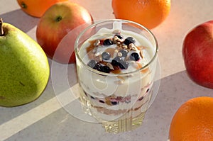 Healthy yogurt with mix of berry, sunflower seeds, bran and honey for healthy morning meal