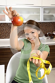 Healthy young female holding a fresh ripe apple