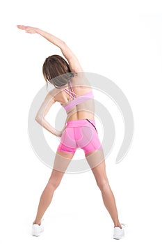 Healthy young fitness personal trainer woman warm up before sport training. Active lifestyle female isolated on white.