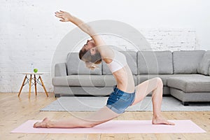 Healthy young girl in Low lunge with upward stretch at home