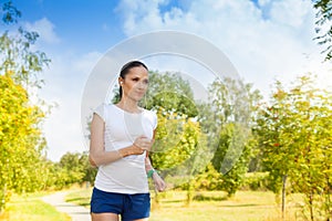 Healthy young woman in autumn park