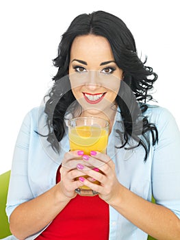 Healthy Young Woman Drinking Large Glass of Fresh Orange Juice