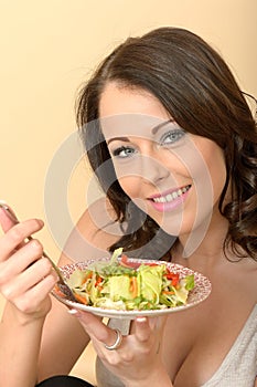 Healthy Young Woman Eating Fresh Crispy Mixed Salad