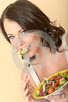 Healthy Young Woman Eating Mixed Salad