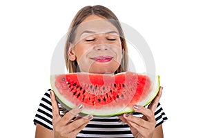 Healthy young woman eating watermelon