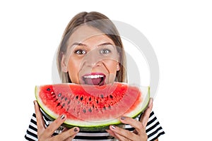 Healthy young woman eating watermelon