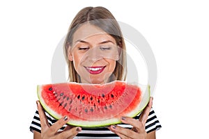 Healthy young woman eating watermelon