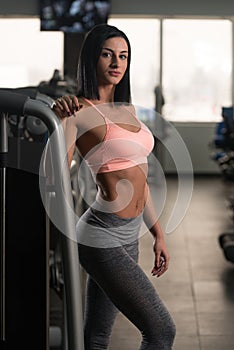 Healthy Young Woman Flexing Muscles