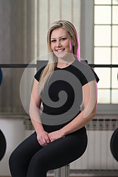 Healthy Young Woman Flexing Muscles