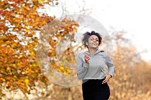 Healthy young woman jogging outdoors