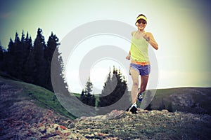 Healthy young woman trail runner running