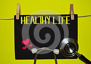 HEALTY LIFE on top of yellow background. Medical