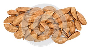 Heap of almond nuts isolated on white background. Unpeeled almonds close-up. Nuts pile. Top view